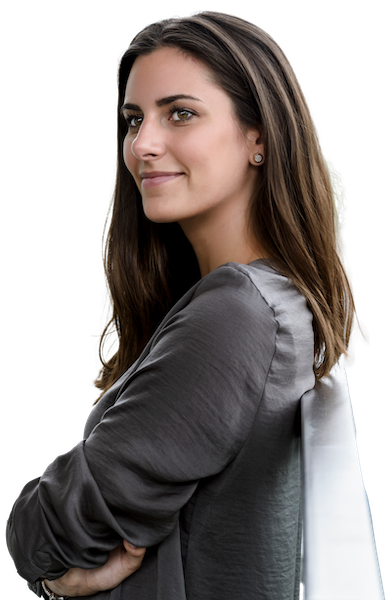 A female independent insurance agent leaning against a railing with her arms crossed.