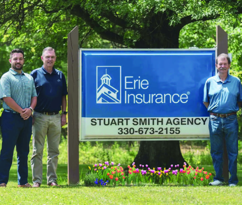 cole smith and team by billboard sign