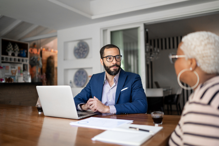 Independent insurance agent meeting with clients