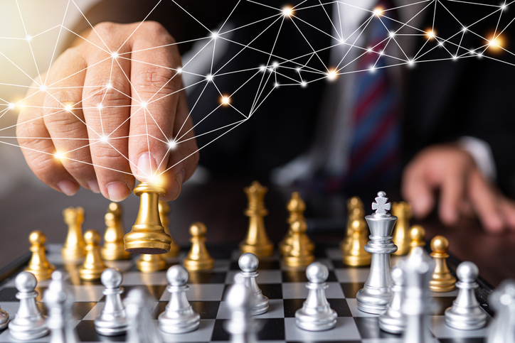 businessman moves king of chess with connection line