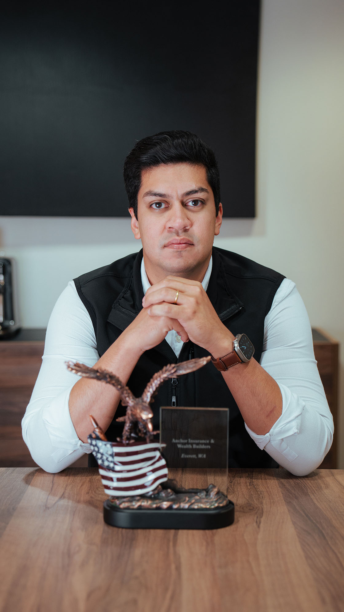 Darly sitting at table with Smart Choice Leadership Eagle award