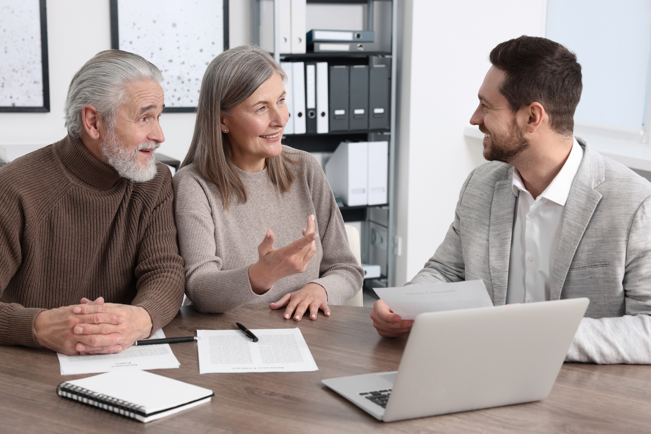 stock photo of an independent insurance broker sells insurance products and assists insurance buyers in finding the best insurance policies for home insurance and auto coverage by comparing various policy options from various companies to get the best deal.