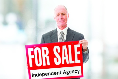 Man Holding For Sale Sign