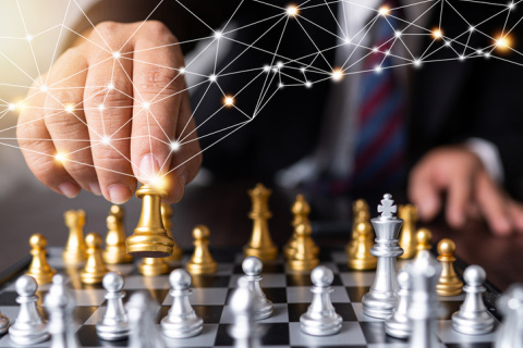 businessman moves king of chess with connection line