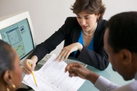Independent insurance agents analyzing financial performance.