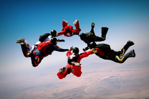skydivers mid jump in a circle