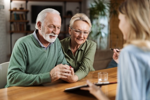 Mature couple having a meeting with their Smart Choice financial advisor stock photo