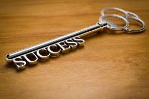 Key-with-success-spelled-along-end