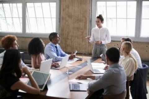 Millennial-aged independent insurance professionals working at a table