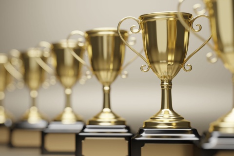 a row of gold trophies