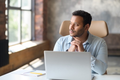 An independent insurance agent weighing the pros and cons of joining an insurance agency network.