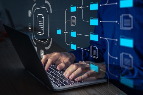 An IT professional setting up software storage to protect his independent insurance agency from the risk of identity theft and cyber attacks.