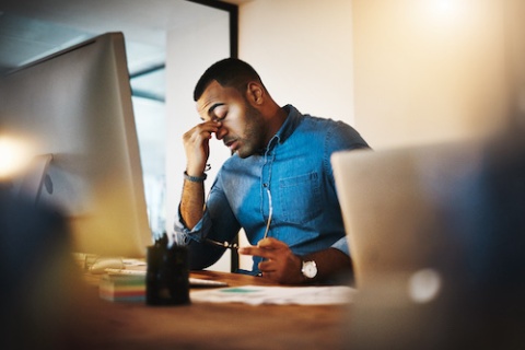Shot of an independent insurance agent experiencing stress due to an errors and omissions insurance claim.