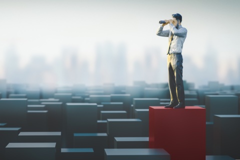 Agency owner evaluating market trends and business valuation to maximize insurance agency sale price.