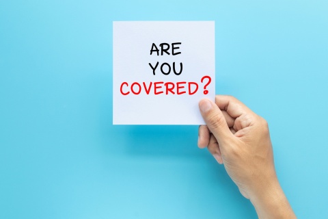Post-it note with 'Are you covered' text highlighting the importance of criminal investigation and management control in cyber liability insurance for businesses.