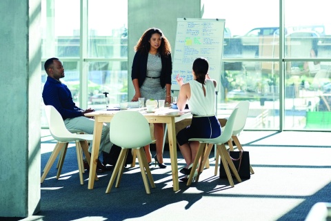 Three team members collaborating 