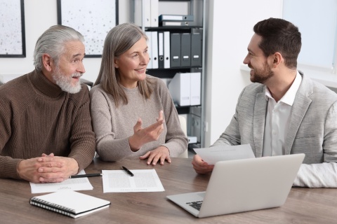 stock photo of an independent insurance broker sells insurance products and assists insurance buyers in finding the best insurance policies for home insurance and auto coverage by comparing various policy options from various companies to get the best deal.