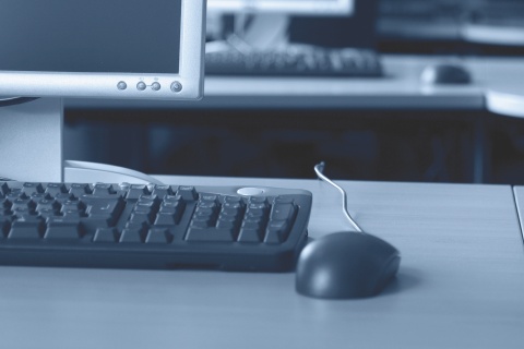 A desktop computer, keyboard, and mouse.