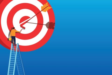 Arrow hitting target next to man on a ladder