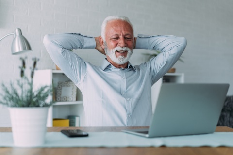 A businessman engages in a video call, discussing insurance coverage and professional services. Technology is reshaping connections in the insurance industry. 