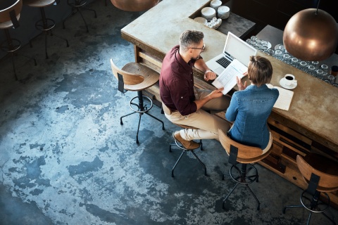 A small business owner discussing their commercial insurance options with an independent insurance agent.