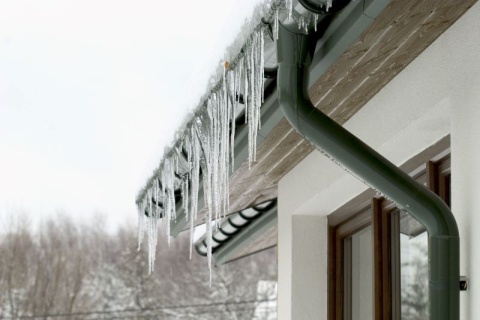Frozen icicles hanging off a roof of a house in 2021 Texas storm